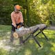 Man in protective gear cutting into log with the MS 251 WOOD BOSS®