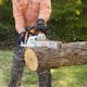 Man with MS 251 WOOD BOSS® cutting a log