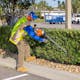 	Man trimming side of a hedge with HS 97 T wearing a STIHL Reflective Safety Vest