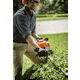 Man trimming hedge using the HS 87 T