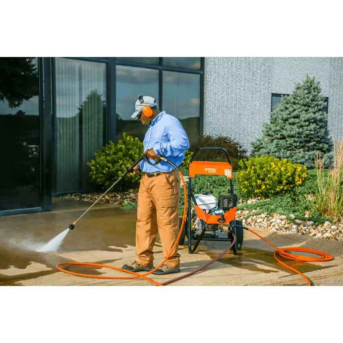Man using RB 800 to wash patio