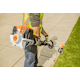 Close up of man trimming sidewalk's edge using the KM 131 R
