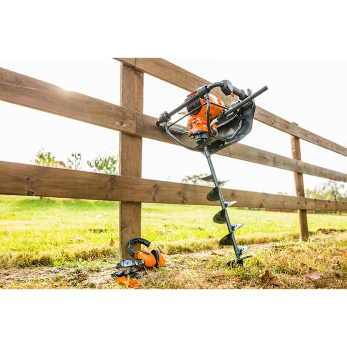 BT 131 leaned up against a fence next to STIHL protective apparel 