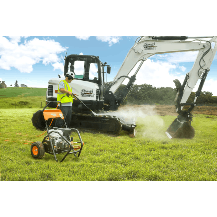 Man cleaning off heavy machinery in field with the RB 600