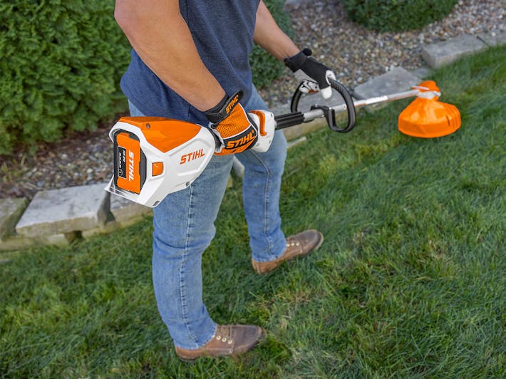 Side view of the AK 20 being used in a STIHL trimmer