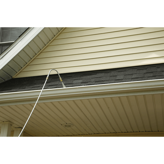 Close up of gutter cleaner being used on house gutters