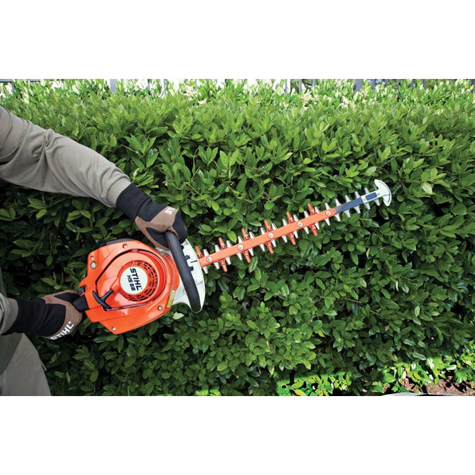 STIHL HS 56 being used to trim hedge