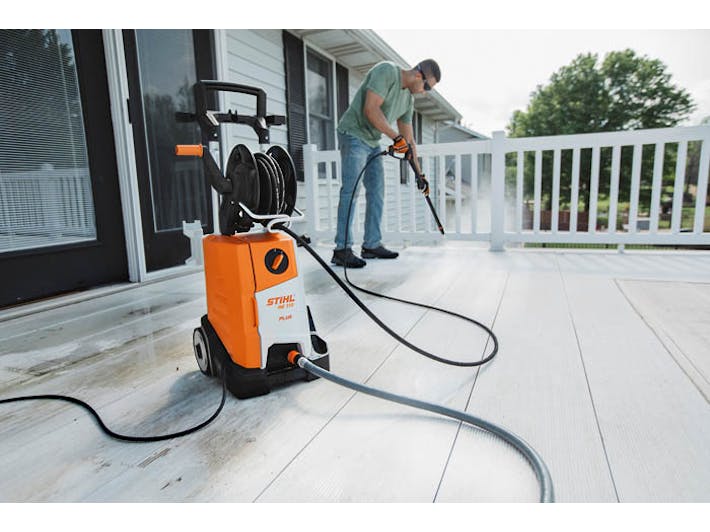 Man cleaning deck with the RE 110 Plus