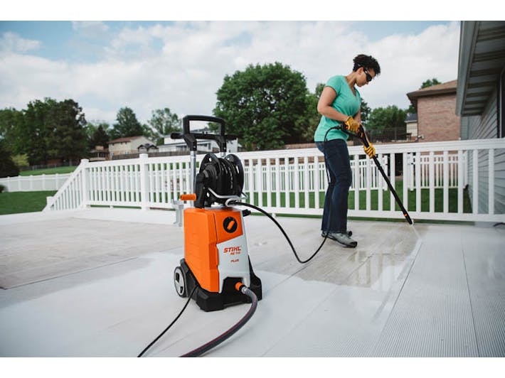 Woman cleaning deck with the RE 110 Plus