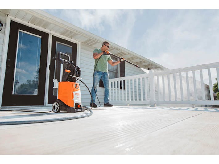 Man cleaning deck with RE 110 Plus