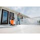 Wide view of man cleaning deck with RE 110 Plus