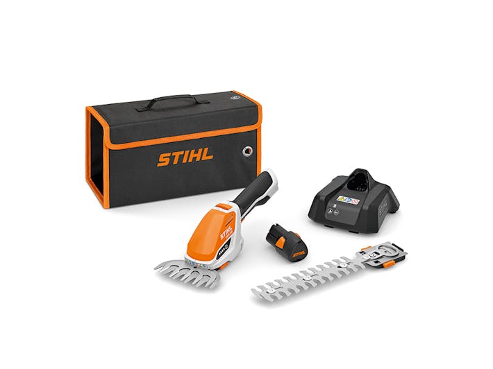HSA 26 kit featuring battery, charger, interchangeable blades, and a transport bag