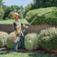 Man using HLA 135 (145°) to trim hedges in STIHL PPE
