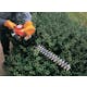 Close up of HS 45 being used to trim a hedge
