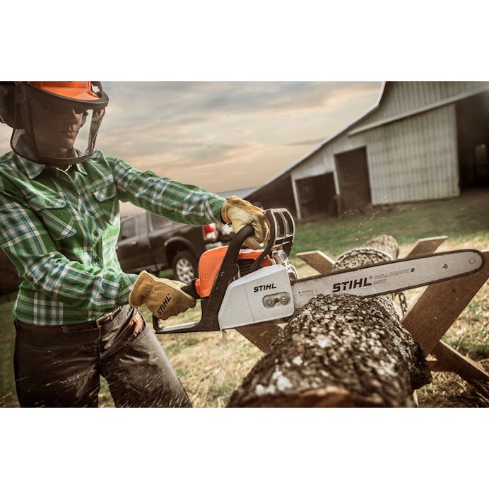 Close up of woman cutting into a log with the STIHL MS 170 Chainsaw