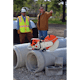 TS 800 STIHL Cutquik® sitting atop a concrete pip with men standing behind