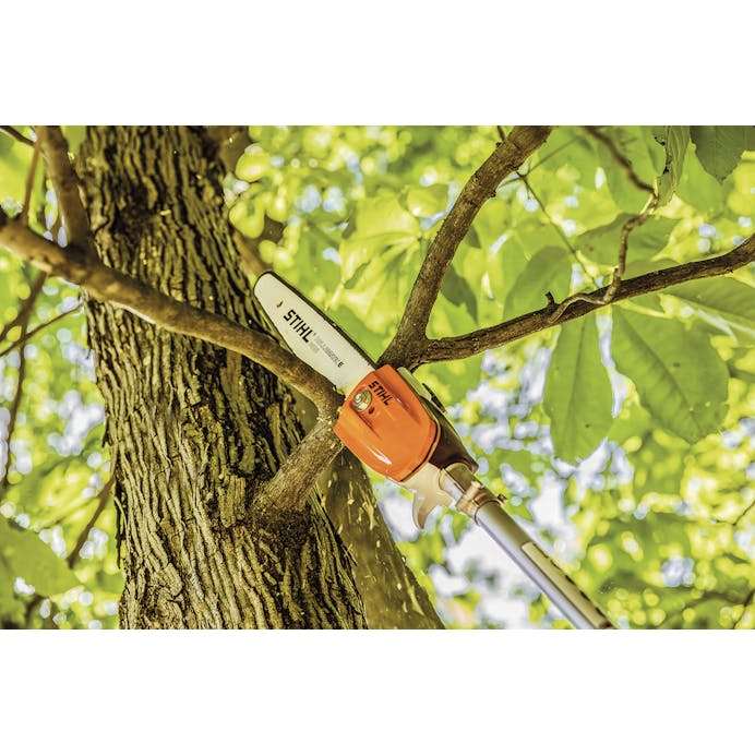 Close up of the HT-KM Pole Pruner attachment being used on tree branches