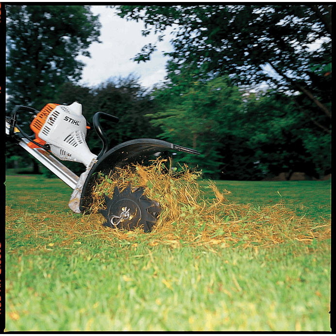 Close up of RL-MM Lawn Aerator Attachment being used on lawn