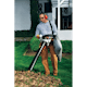 Man picking up leaves in yard with the SH 56 C-E