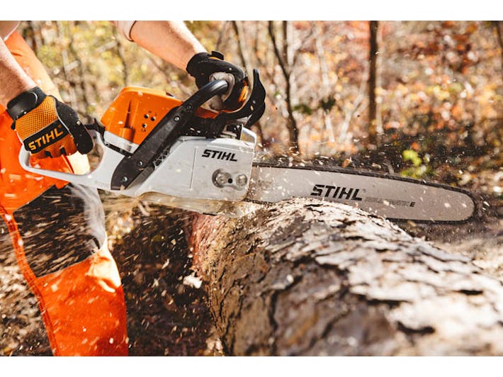 	Man cutting log with MSA 311