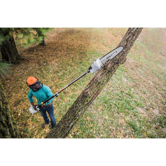 Aerial view of man using the HT 56 C-E to trim tree branch