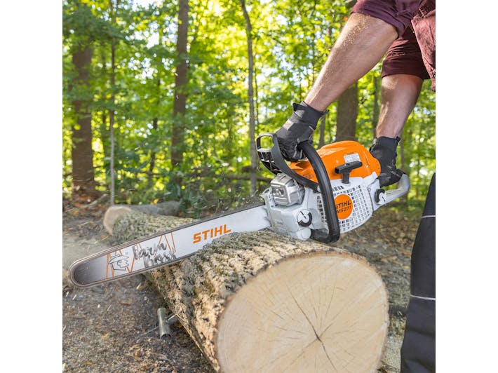 Close up of man cutting log with MS 271 FARM BOSS®