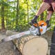 Close up of man cutting log with MS 271 FARM BOSS®