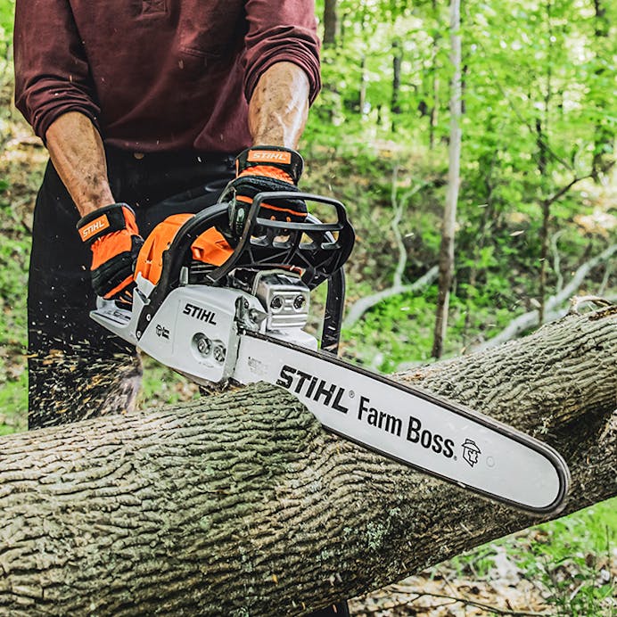 Close up with MS 271 FARM BOSS® cutting a log