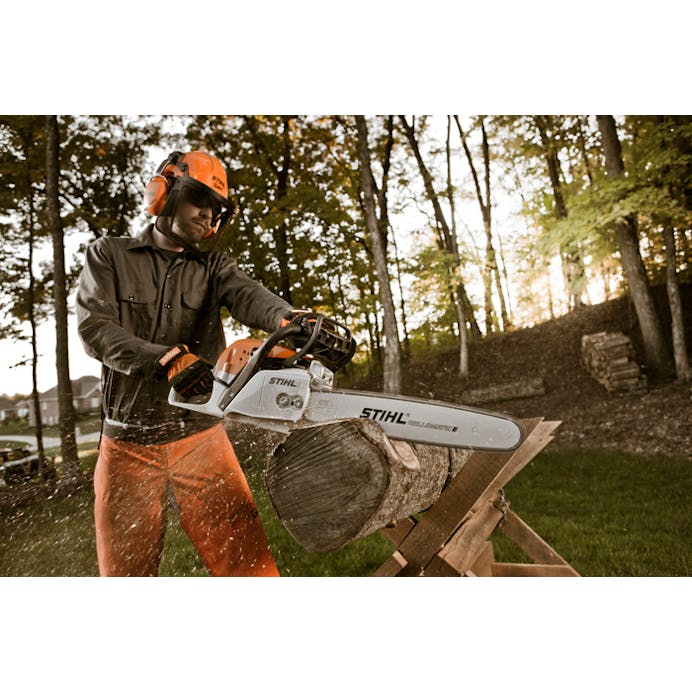 Man cutting log with the MS 291 Chainsaw